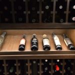 Wine bottles come in various shapes and sizes. This display row highlights and showcases some of the more beautiful bottles in this collection.