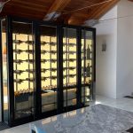 Custom LED backpanels are a dramatic and striking addition to modern Phoenix wine cellars like this one.