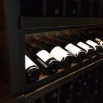 This display row is lit by a custom strip of LED lights that highlight the beautiful bottles.