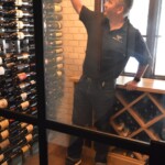 Jake Austad shows the label forward custom wine racking in this Phoenix wine room.