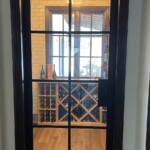 Custom home wine cellars require specialized doors to maintain proper temperature and humidity in the Arizona heat.